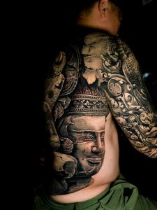 The tattoo on the left is of Lord Brahma.