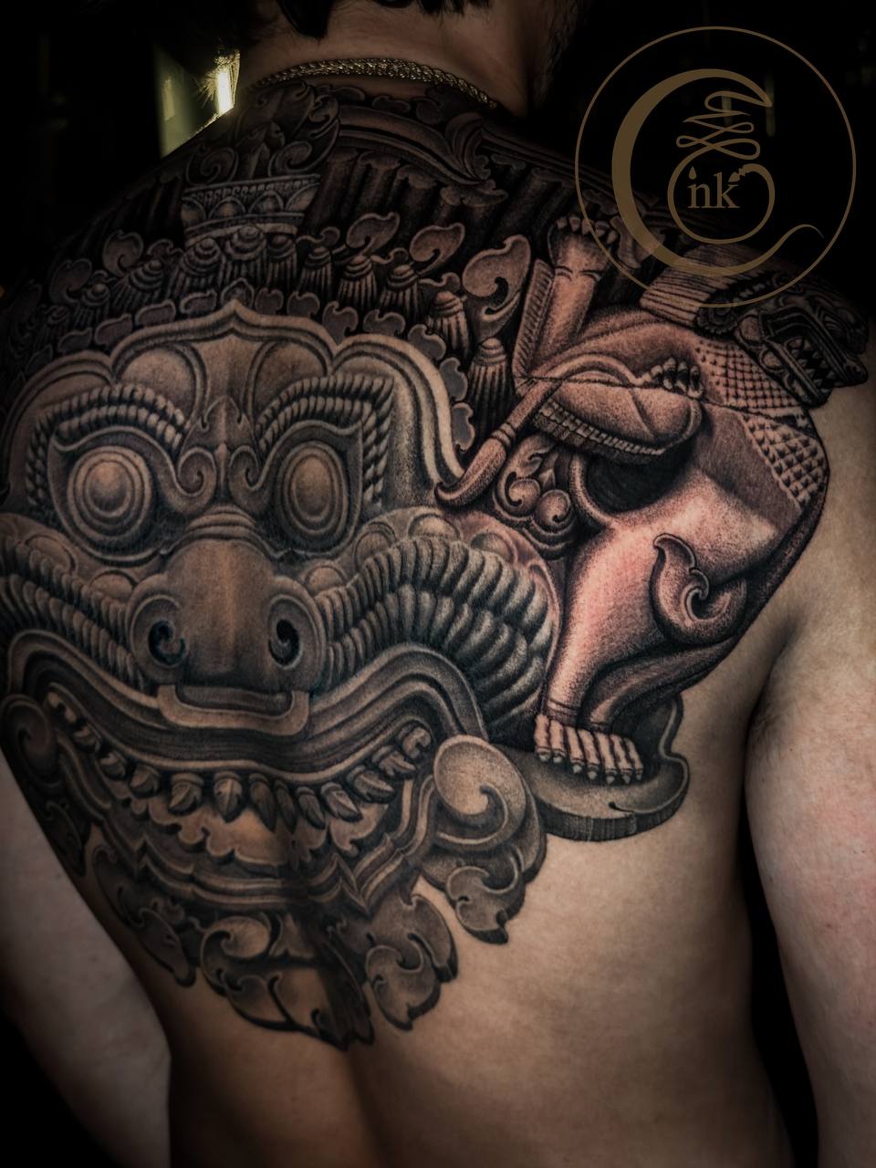 Angkorian-style full-back tattoo featuring Rahu and a lion — photo 4