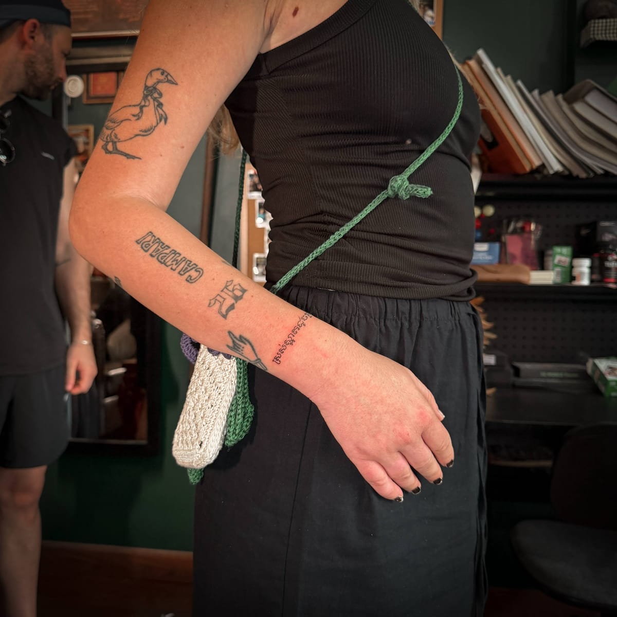 The Khmer script tattoo “ស្រស់ស្អាតដូចអ្នក” on the client's arm.