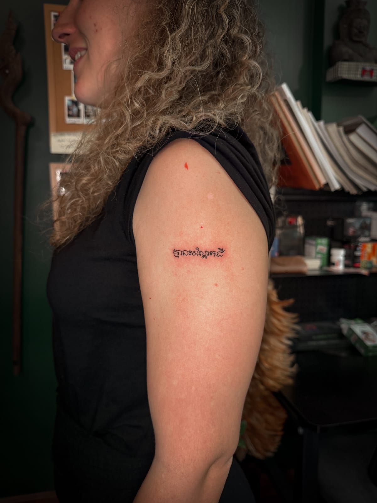 Close-up of a Khmer script tattoo meaning “No peanut.”